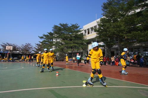 Jasmine and Tony Roller Blade at School